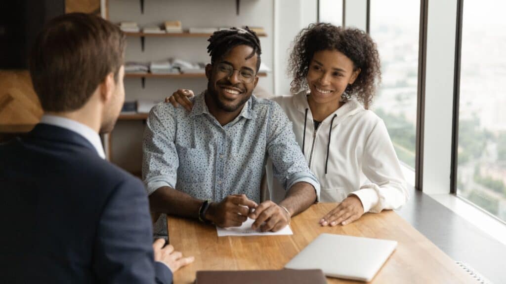 couple meeting with lawyer. Financial advisor.