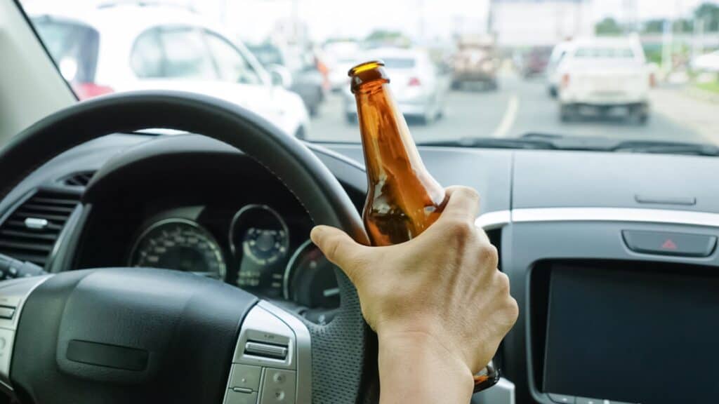 drunk driver. Drinking while driving. Irresponsible.