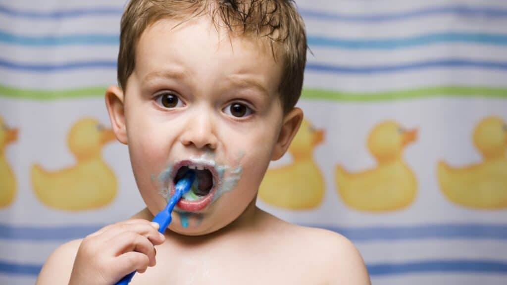 kid brushing teeth. 