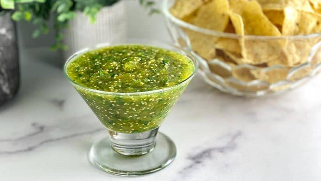 Salsa-Verde-in-glass-dish-chips-in-background.