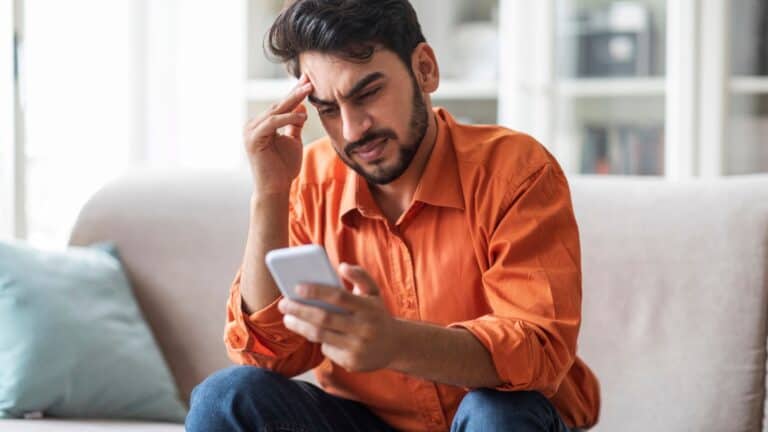 man upset with phone.