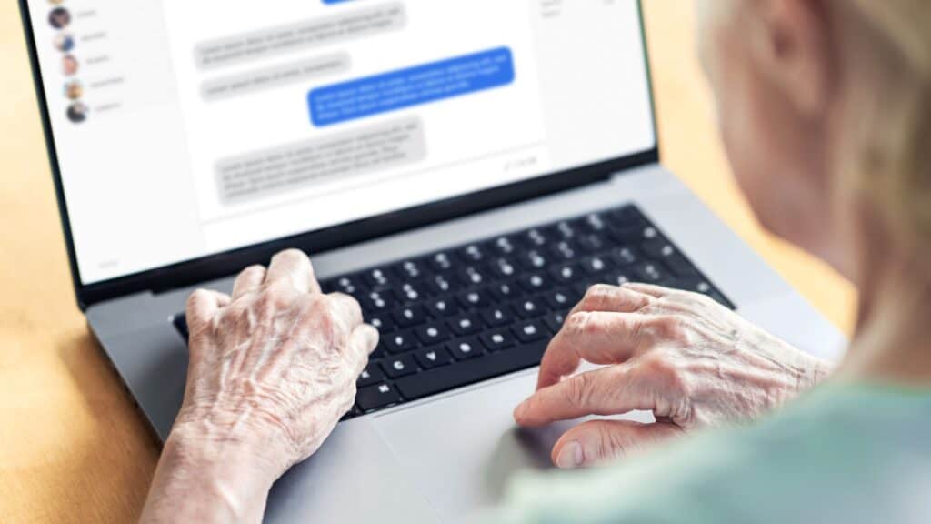 older woman chatting on laptop. 