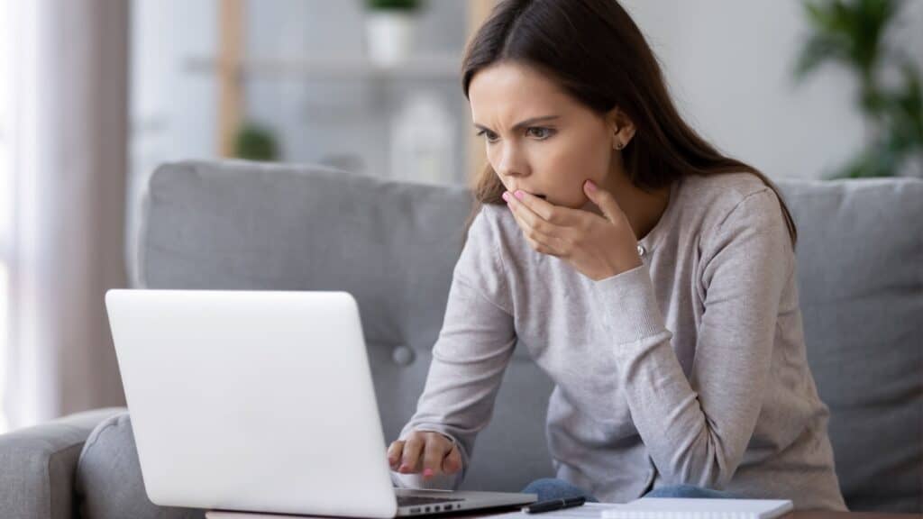 shocked surprised woman on computer. 