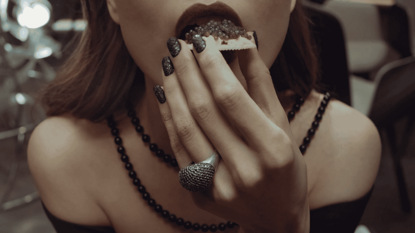 woman eating caviar.