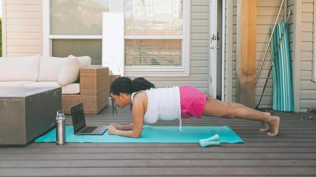 woman-on-deck-holding-a-plank.