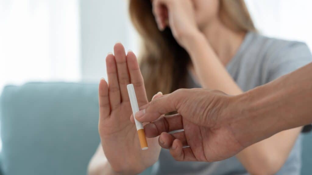 woman saying no to cigarette.