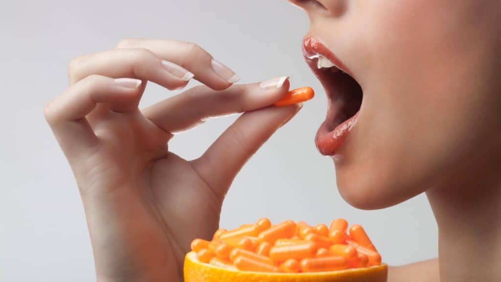 woman taking Vitamin C.