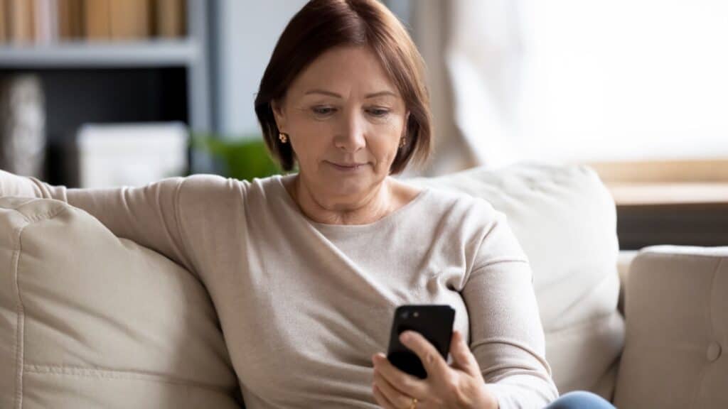 woman using phone.