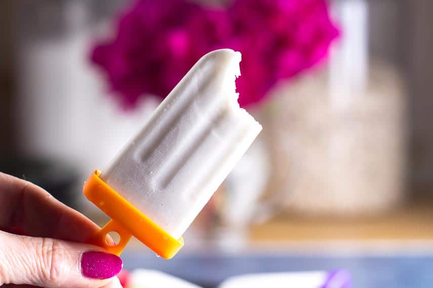 bite-taken-out-of-low-FODMAP-coconut-popsicles.