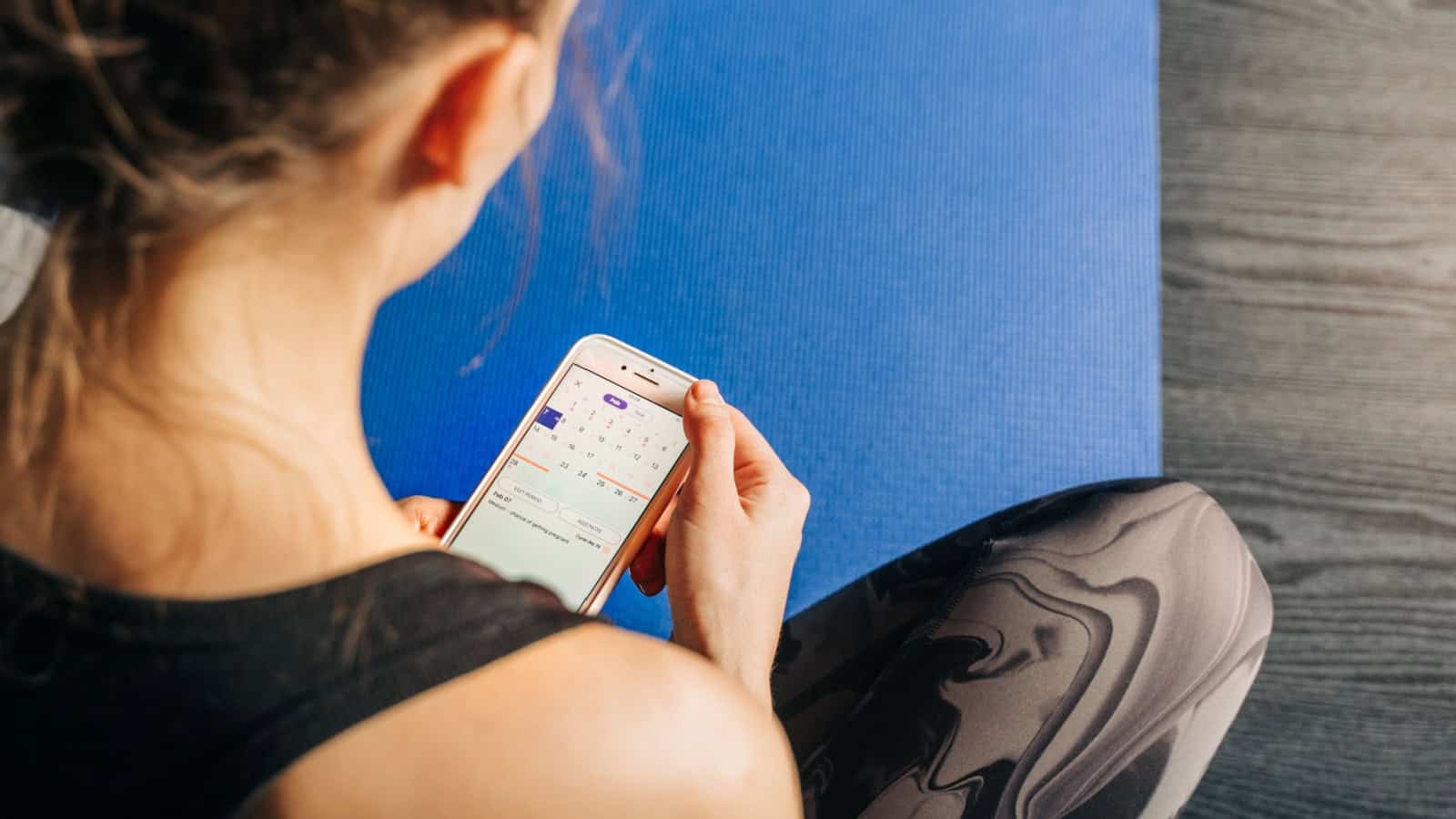 woman using period tracker.