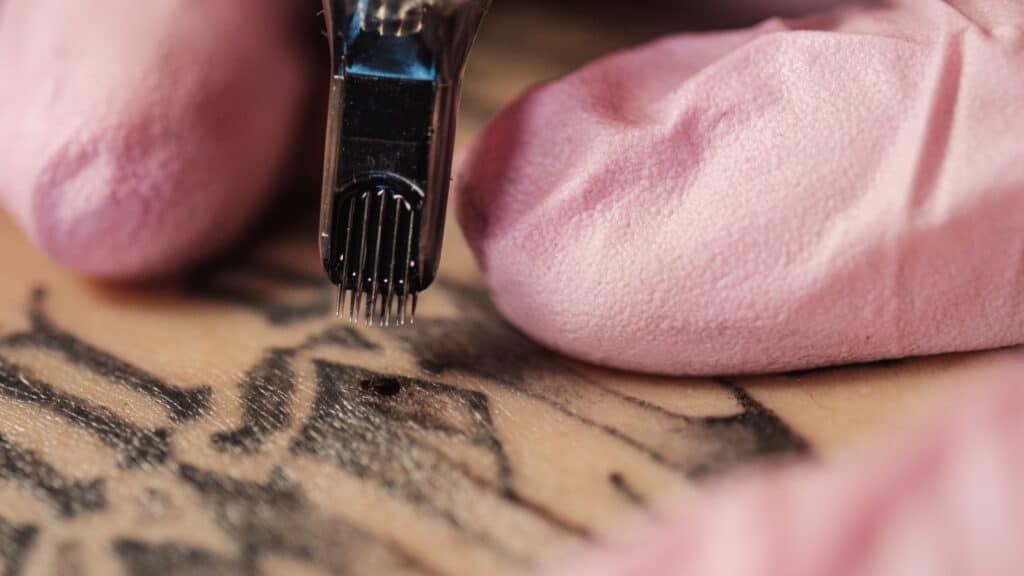 Closeup of tattoo artist.