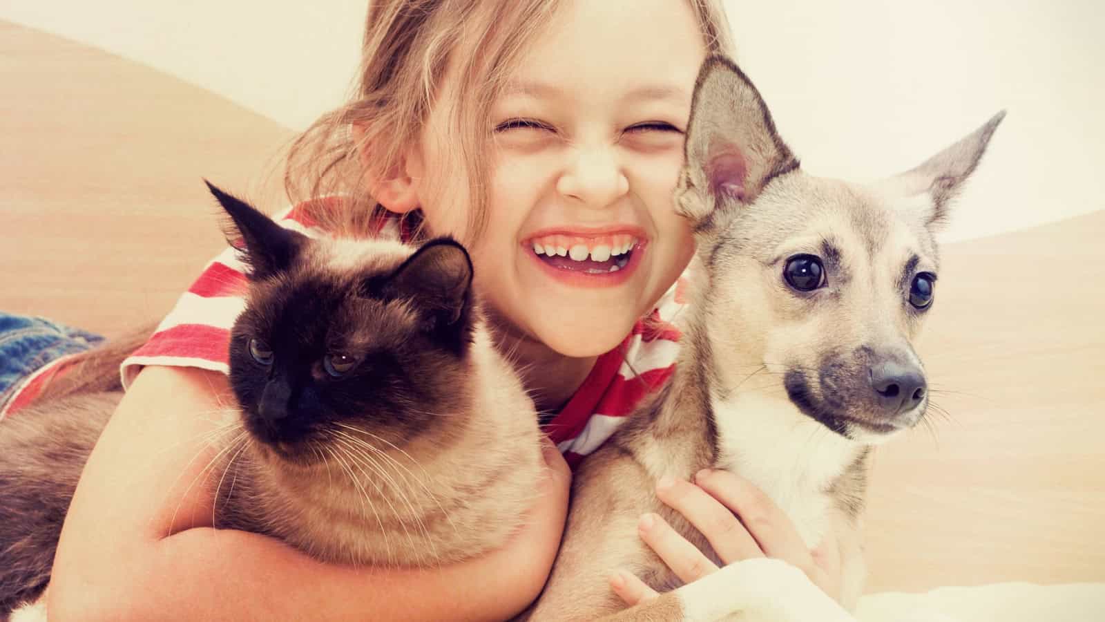 Girl with cat and dog.