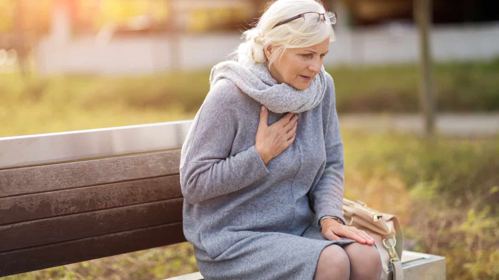 heart attack. Holding chest.