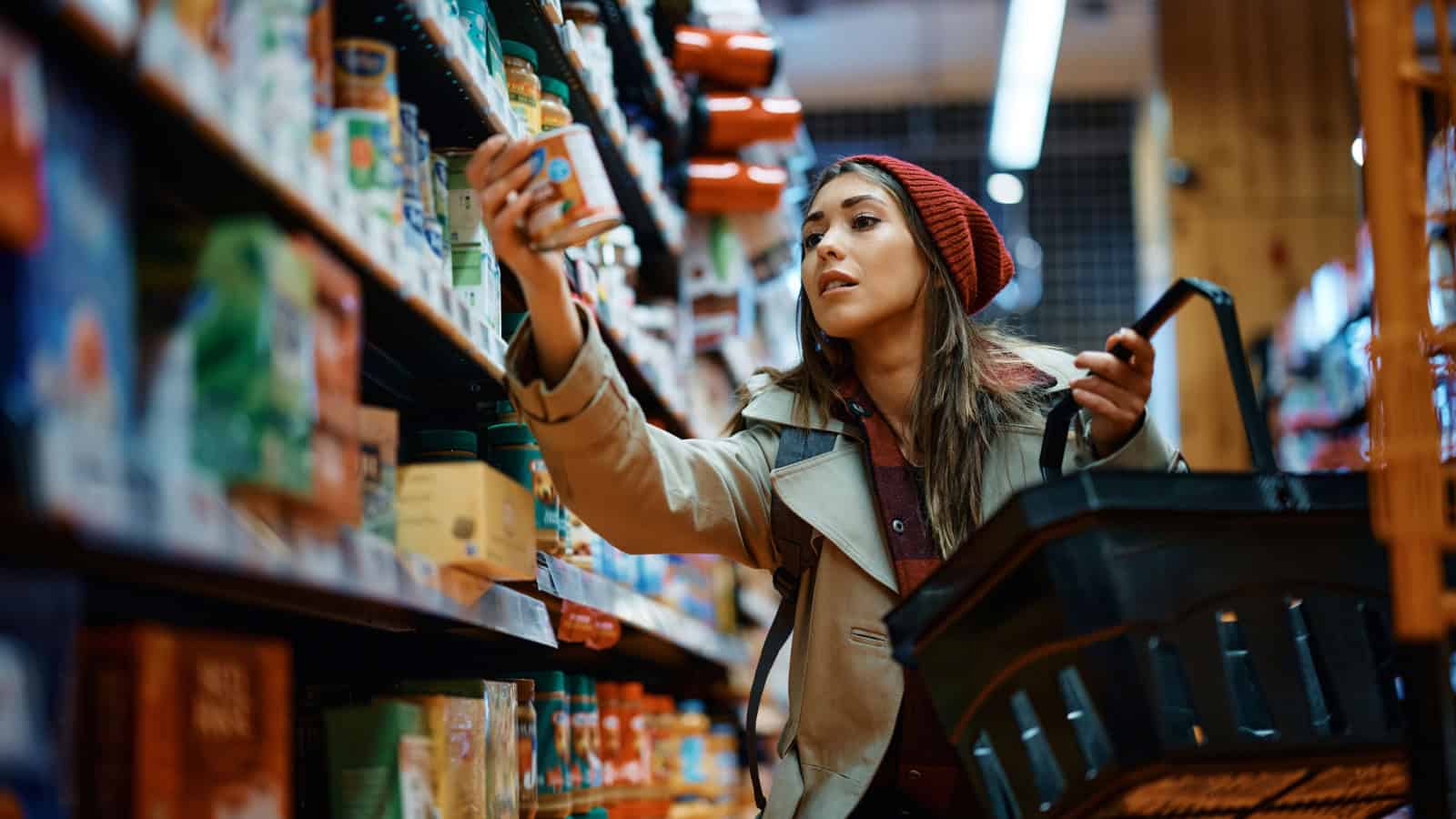 woman shopping for canned goods.