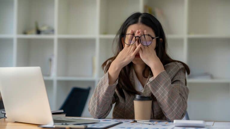 Tired frustrated woman with computer.