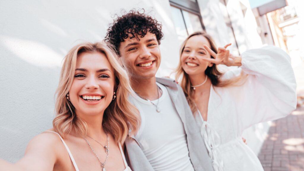 two women and a man.