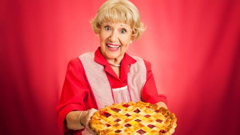 Woman serving pie. Lisa F. Young via Shutterstock.