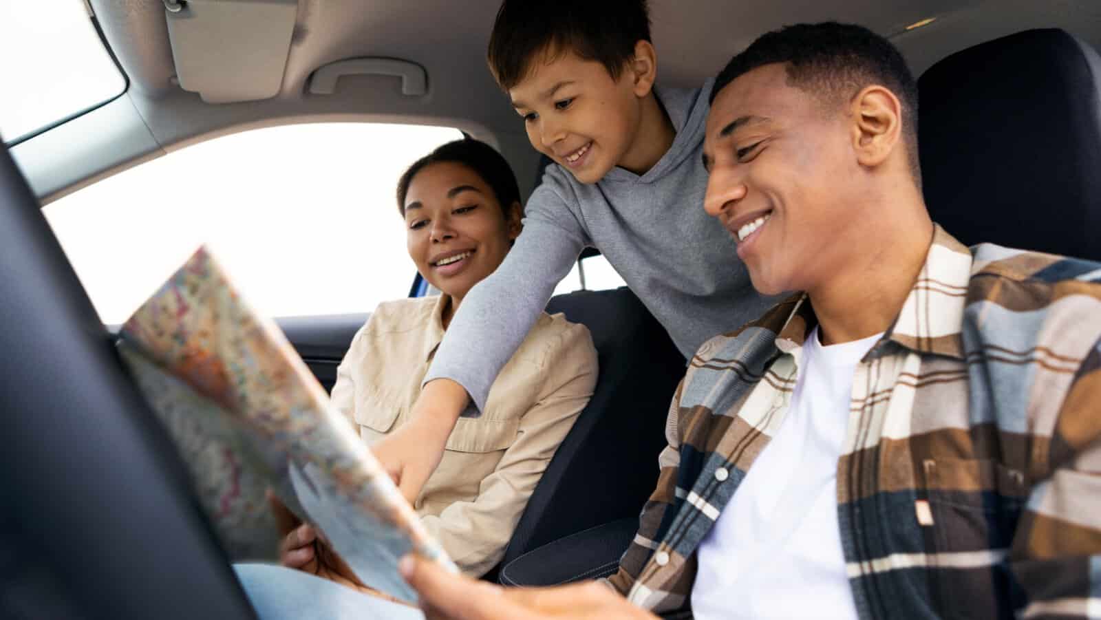 family in car on trip.