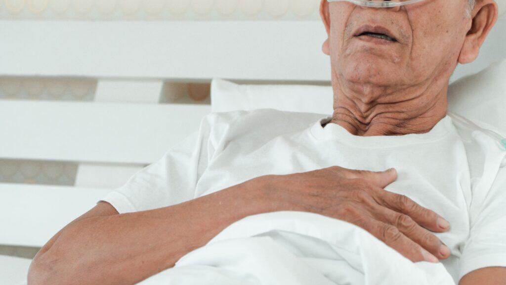 man in hospital bed.