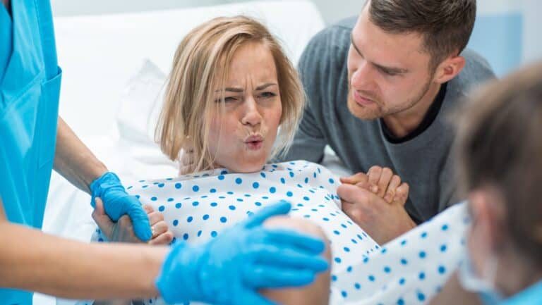 woman birthing.