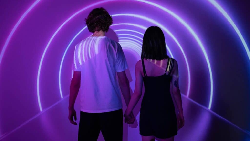People walking into light.