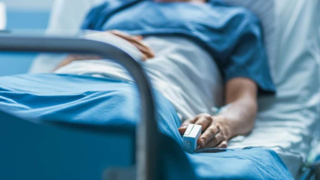 Person in hospital bed.