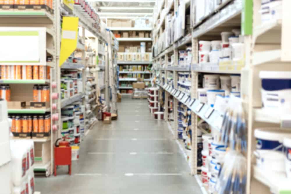 Blurred,Aisle,And,Shelves,With,Building,And,Finishing,Materials,In