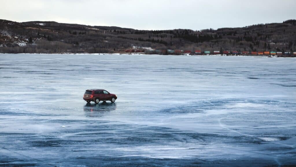 car driving on frozen lake.