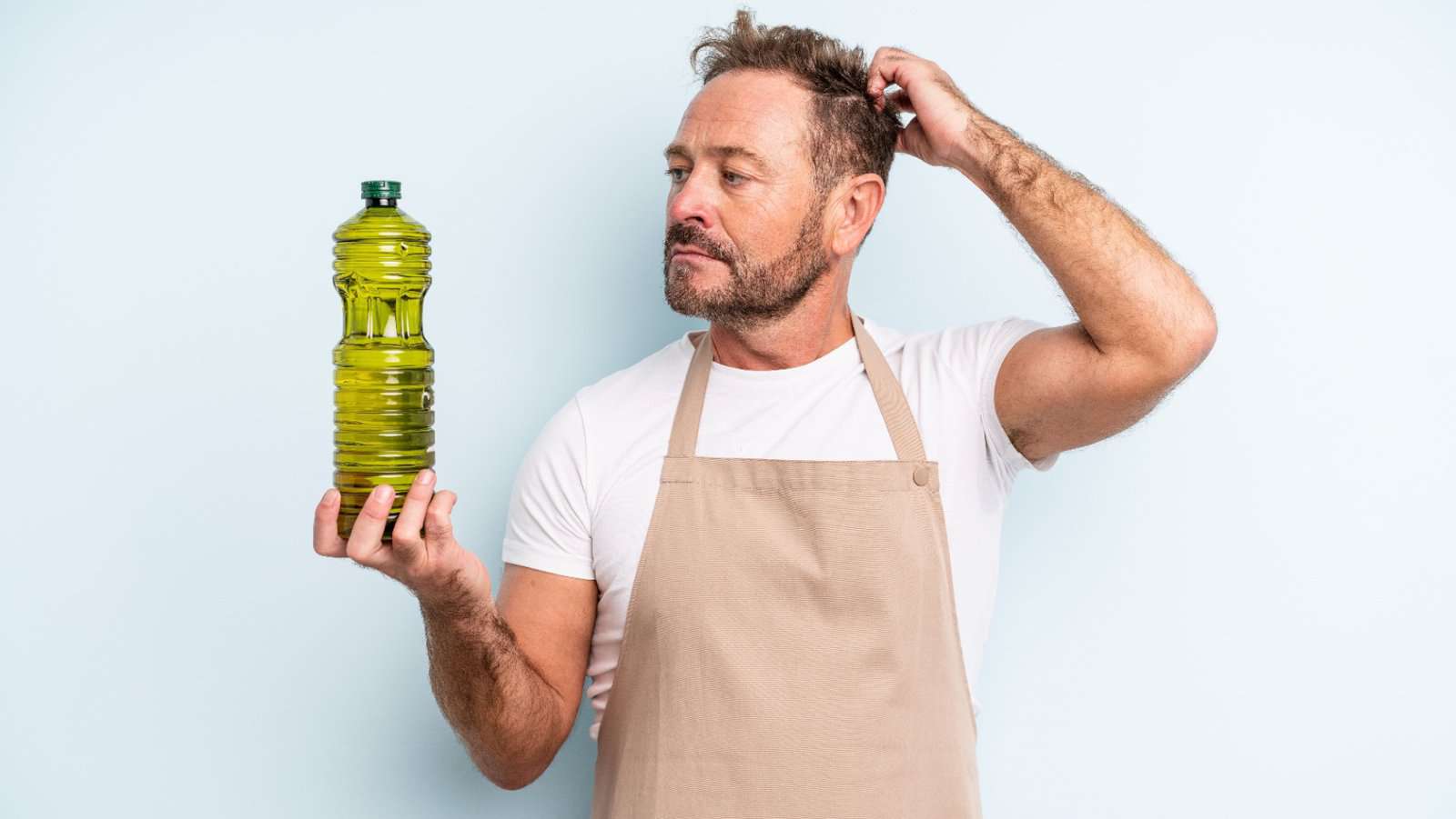 man with oil in bottle.
