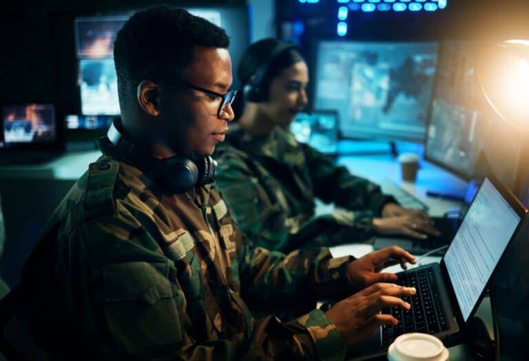 Military,Control,Room,,Computer,And,Soldier,At,Desk,,Typing,Code