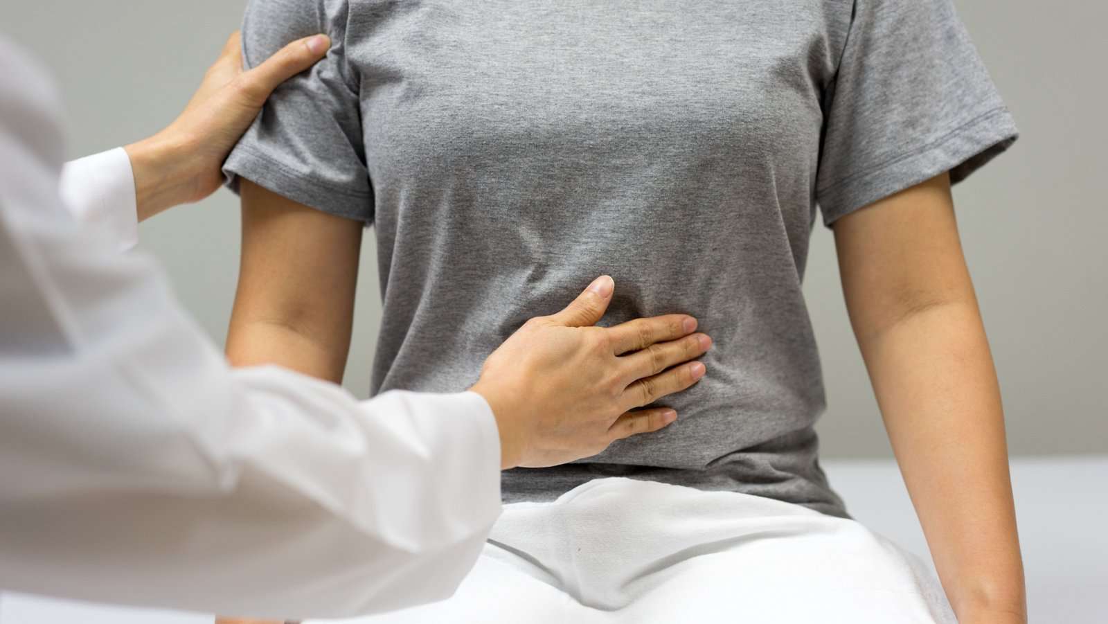 Doctor checking gut.