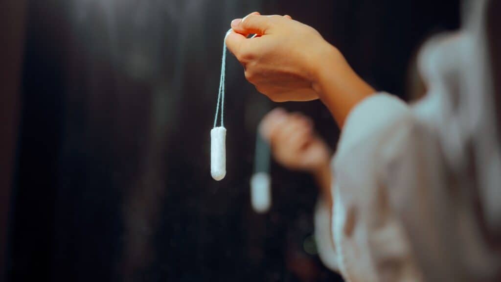 holding a tampon