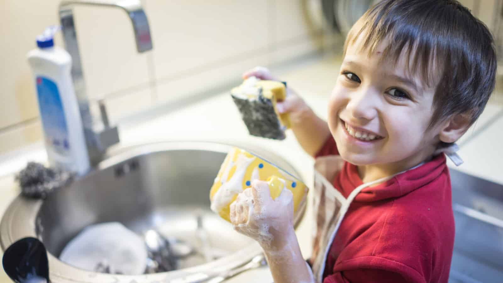 kid washing dishes.