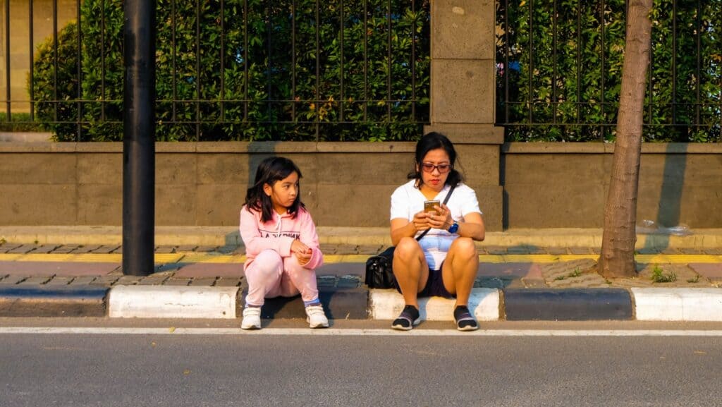 sitting on sidewalk.