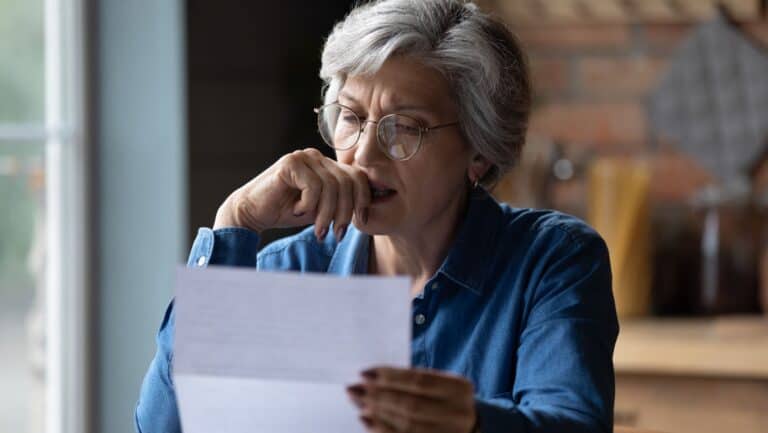 worried woman. paperwork.