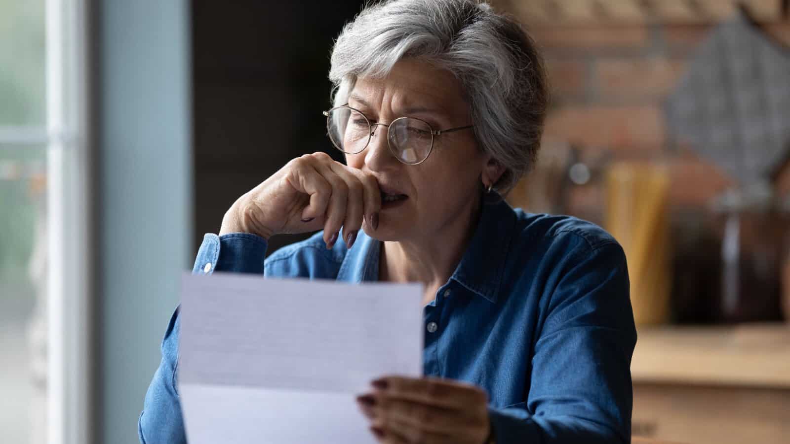worried woman. paperwork.
