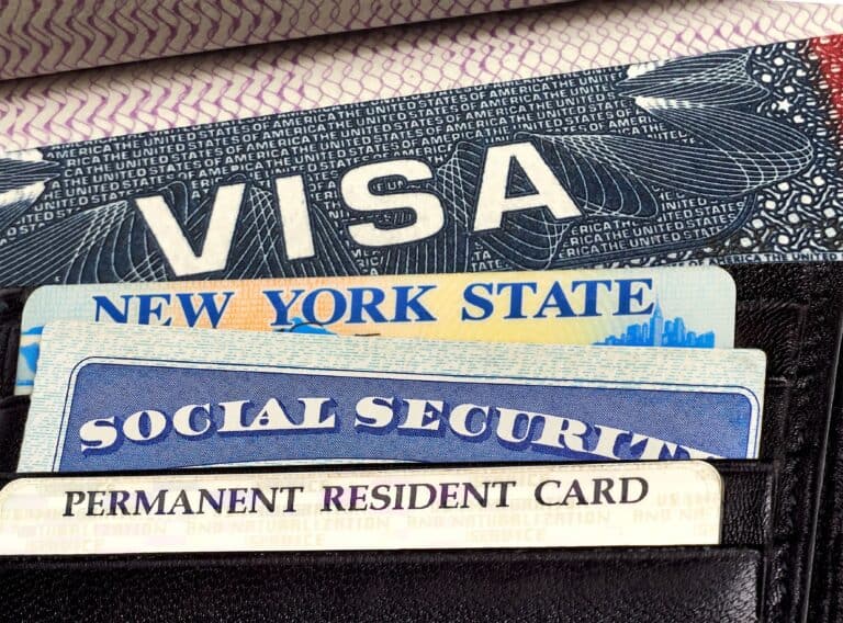 U.S. or America Visa on Passport, Driver License, Permanent resident or green card and Social Security Card in wallet.