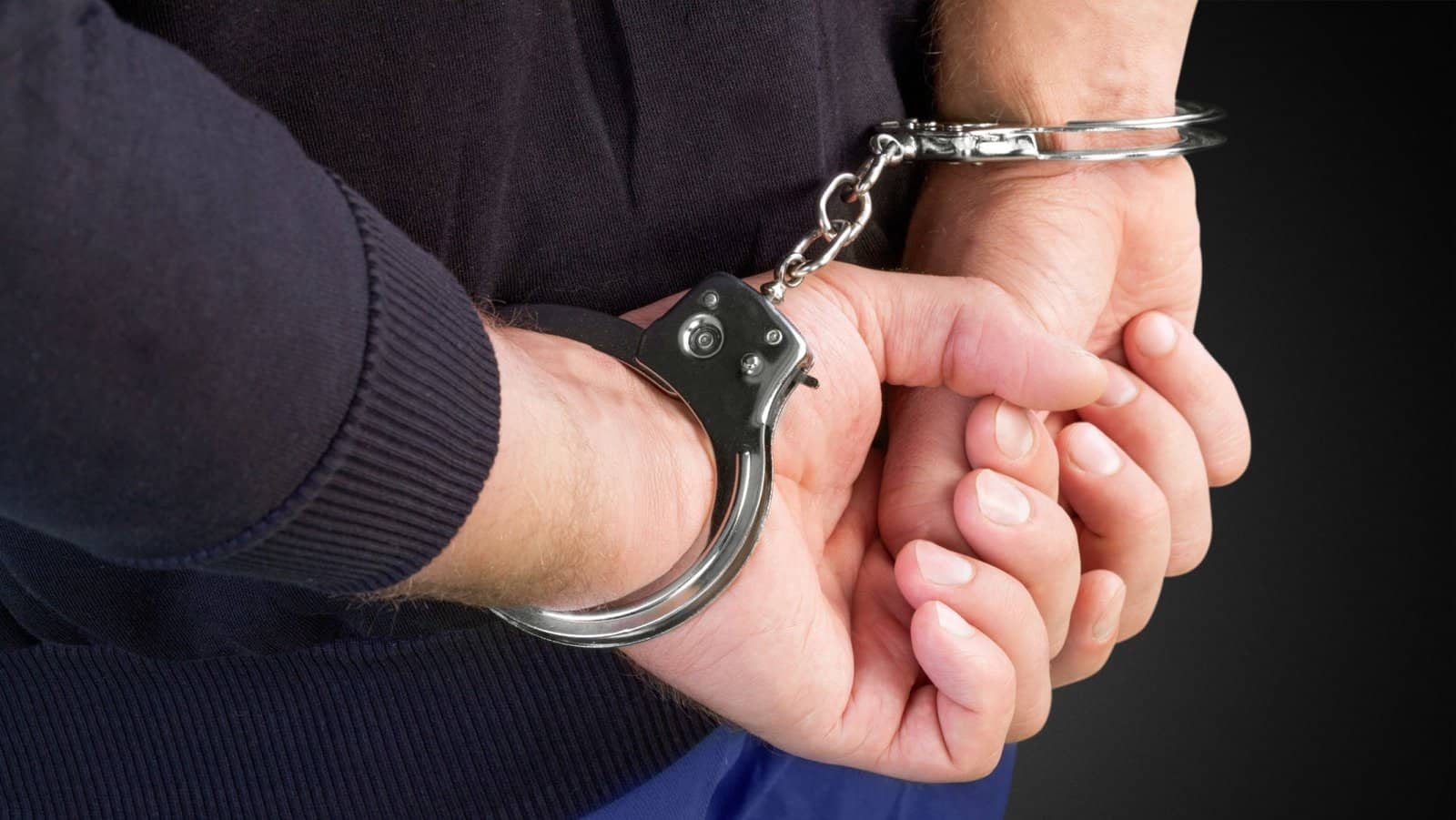 arrested. handcuffs.