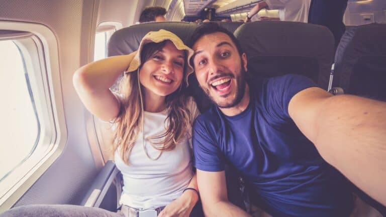 happy couple on plane.