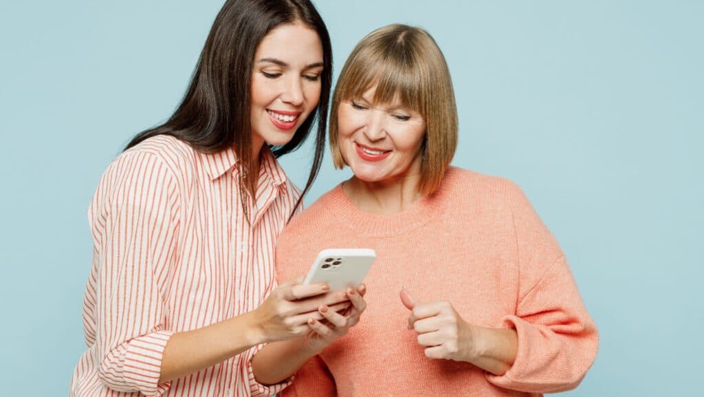 women looking at phone.