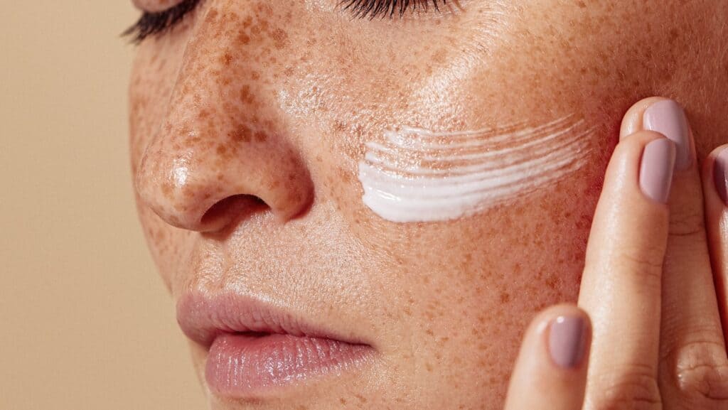 applying face cream.