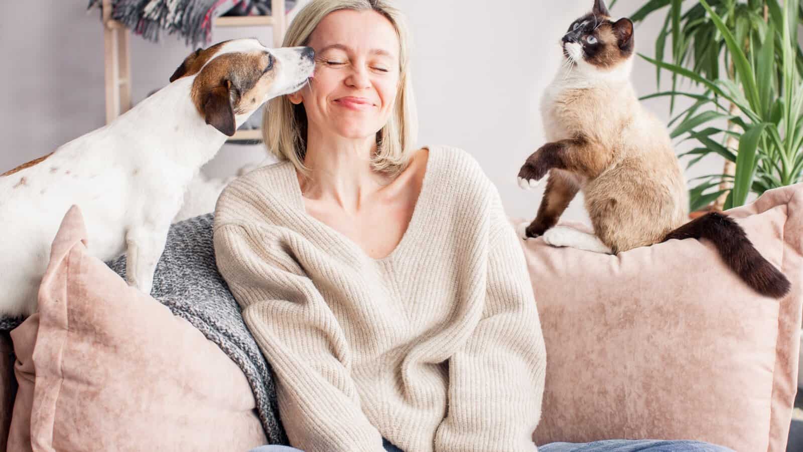 woman with cat and dog.