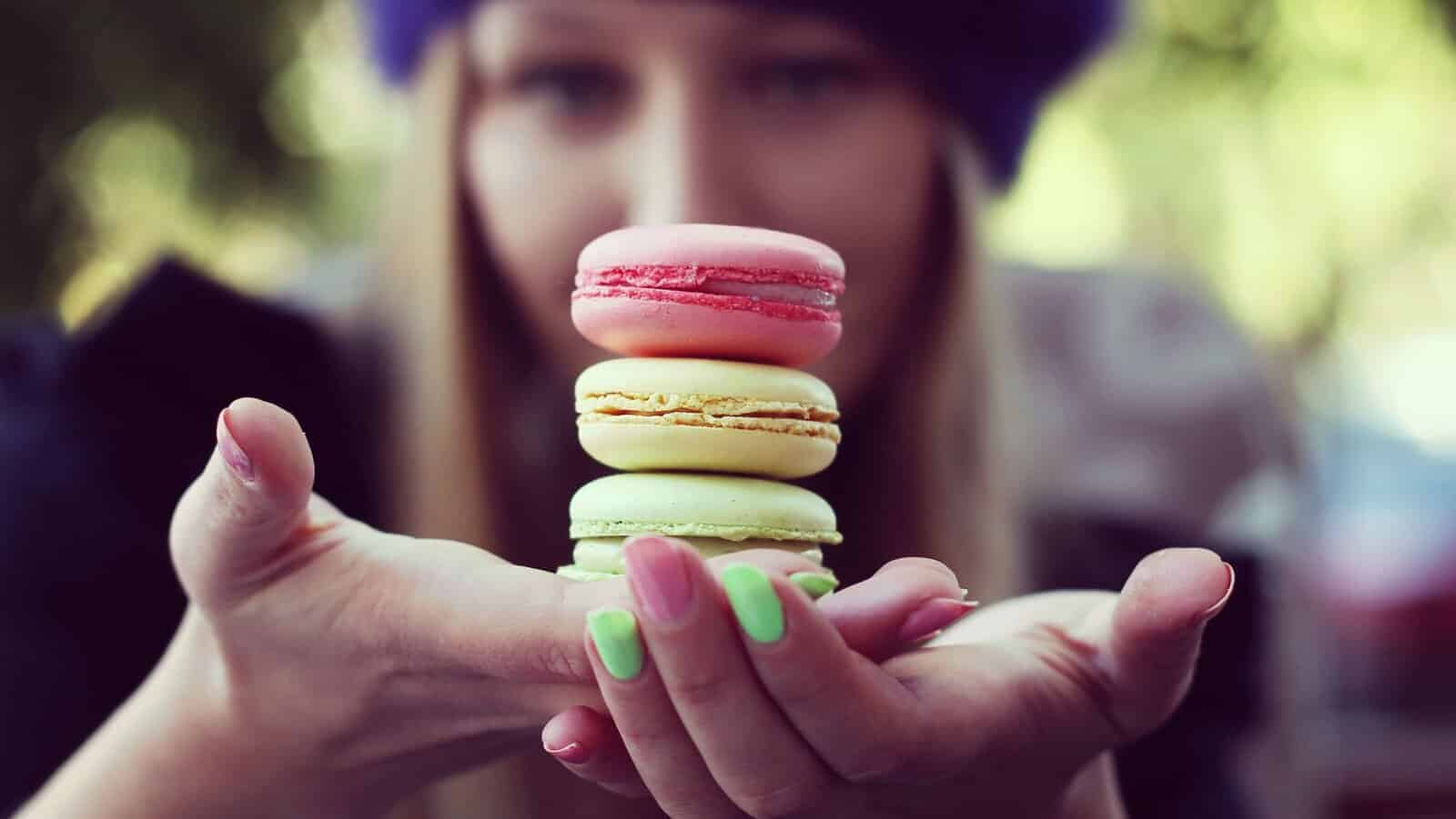Holding macarons.