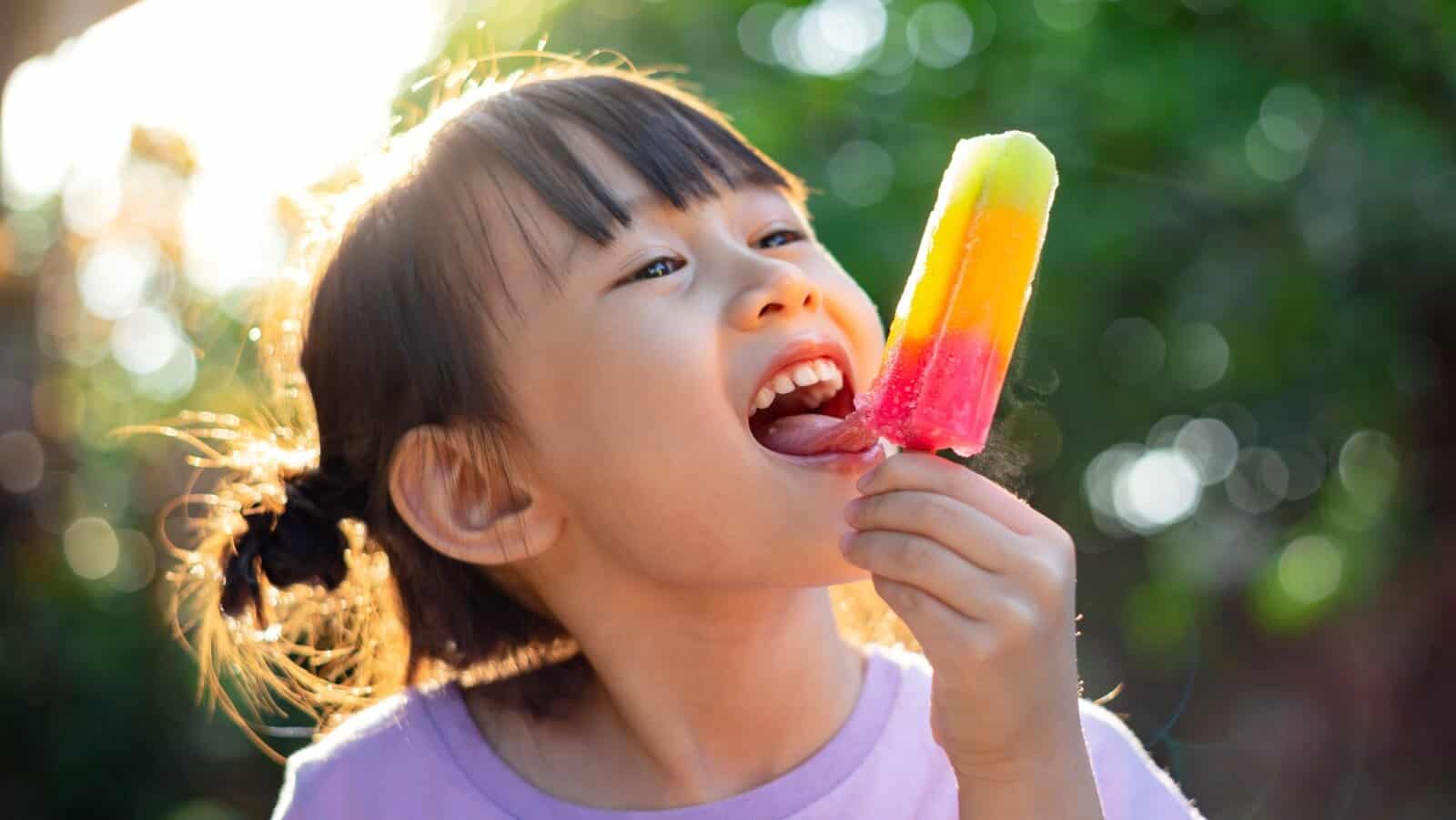 child with popsicle.
