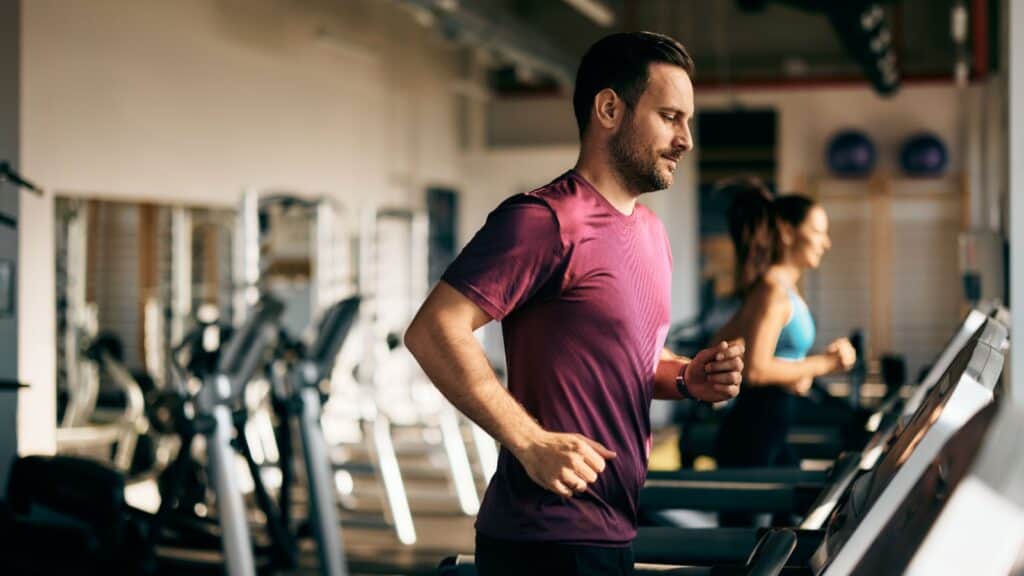 man doing cardio at gym