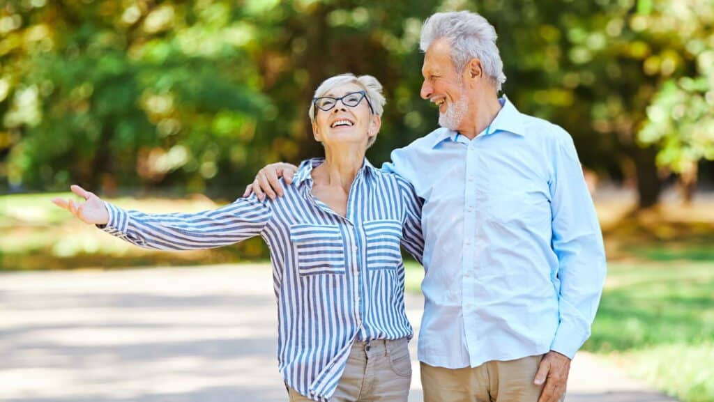senior couple walking and talking.