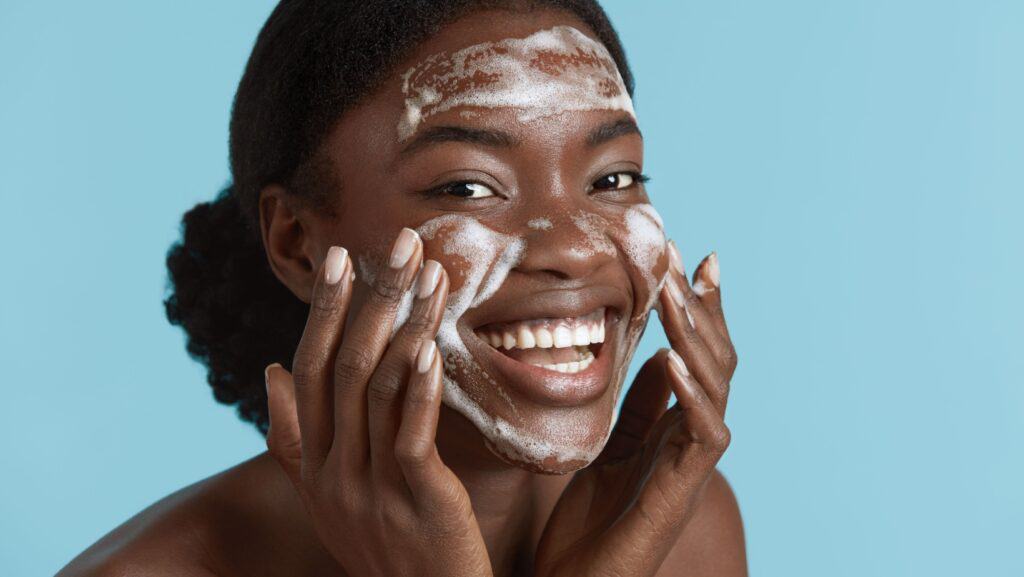 woman washing face.