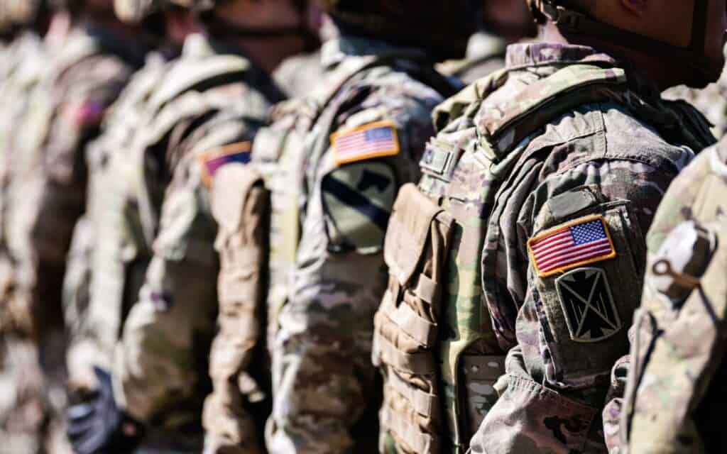 United States Army. Close up photo with the flag of America on soldiers shoulder uniform, US army concept image.