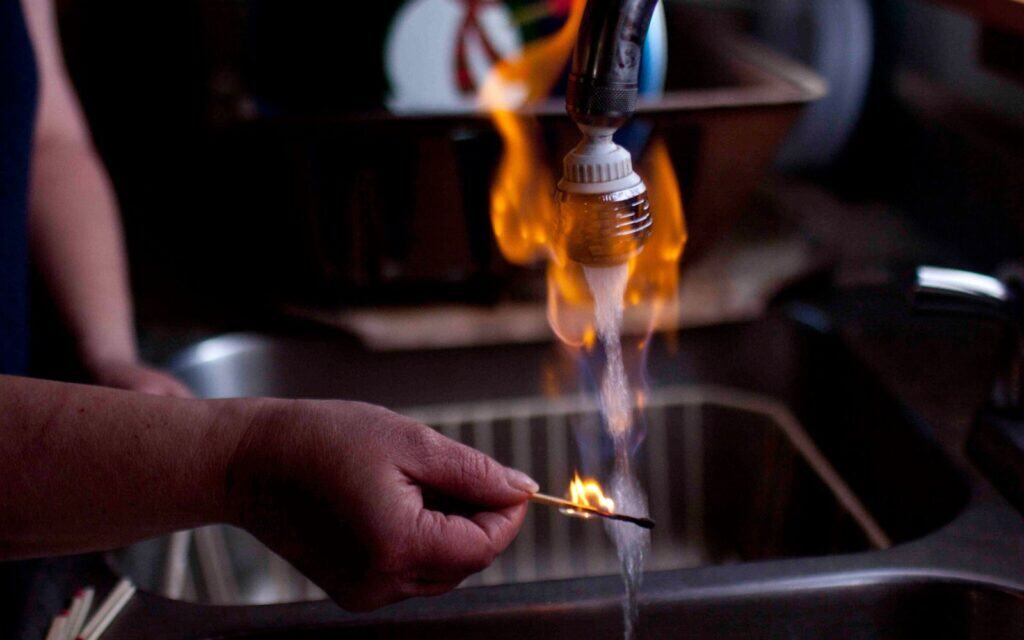 Lighting water on fire. Fracking pollution.