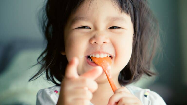 baby eating food. happy baby.